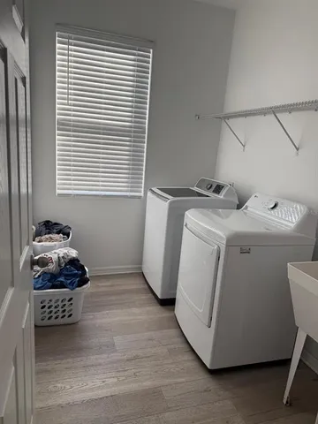 a utility room with dryer and washer