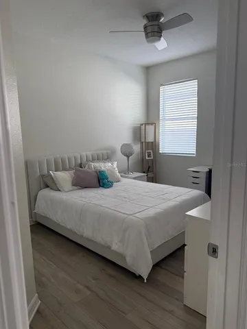 a bedroom with a bed and window