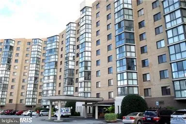 a front view of a building with parking space