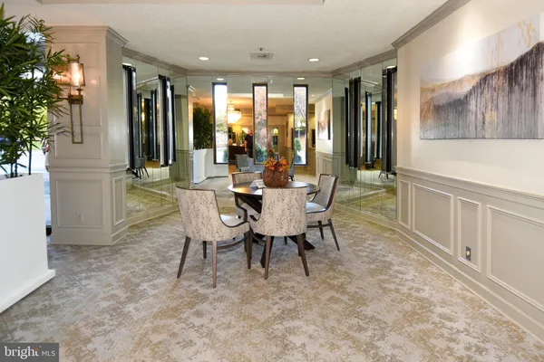 a dining room with furniture and window