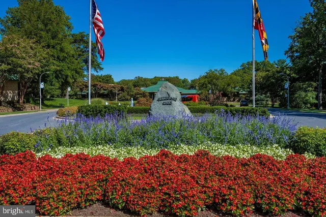 a view of a backyard with sitting area