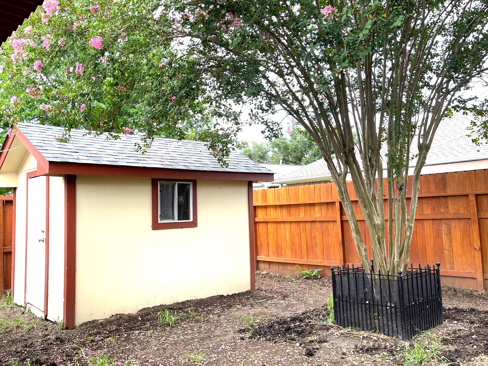 1134 Somercotes Lane Channelview, TX 77530 - Photo 11 of 13 a backyard of a house with wooden fence and large trees