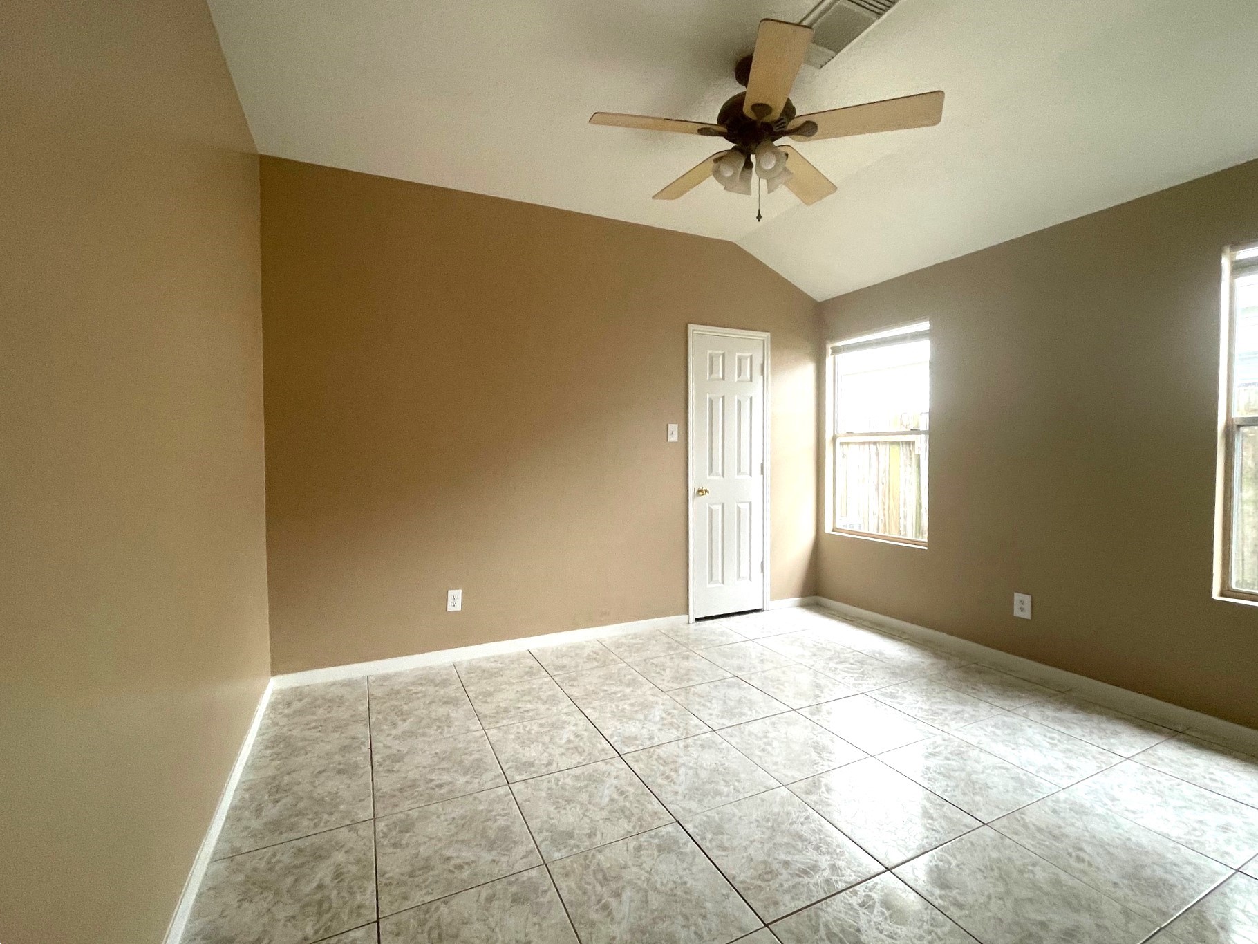 1134 Somercotes Lane Channelview, TX 77530 - Photo 7 of 13 a view of a room with a chandelier fan and windows