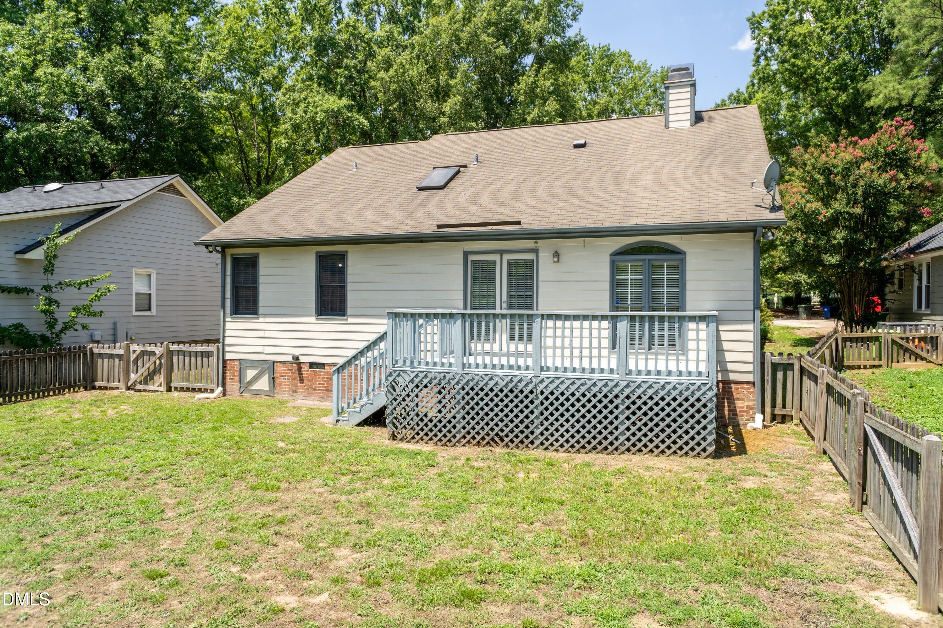 5604 Spring Pines Way Raleigh, NC 27616 - Photo 17 of 22 a backyard of a house with table and chairs