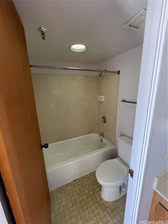 a bathroom with a sink a toilet a bathtub and shower