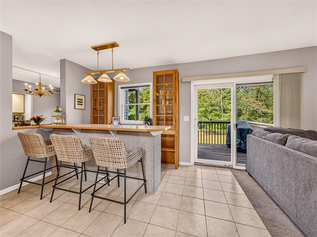 233 Dean Road Parma, NY 14559 - Photo 11 of 42 Wet Bar area with sliding glass doors to the deck.