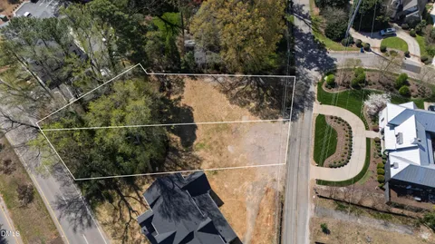 a backyard of a house with wooden floor and fence