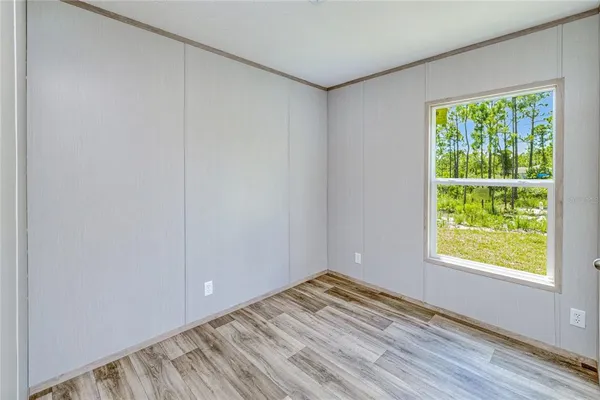a view of a room that has a window in it