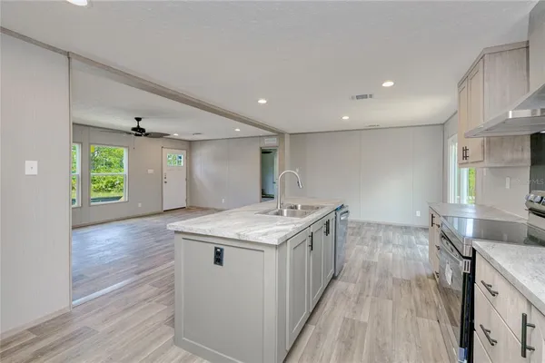 a kitchen with a stove and a sink