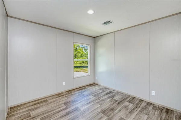 a view of an empty room with a window