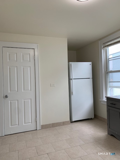 18 Lawrence Street Norwalk, CT 06854 - Photo 7 of 31 an empty room with a kitchen
