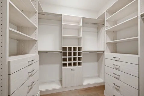 a view of an empty walk in closet