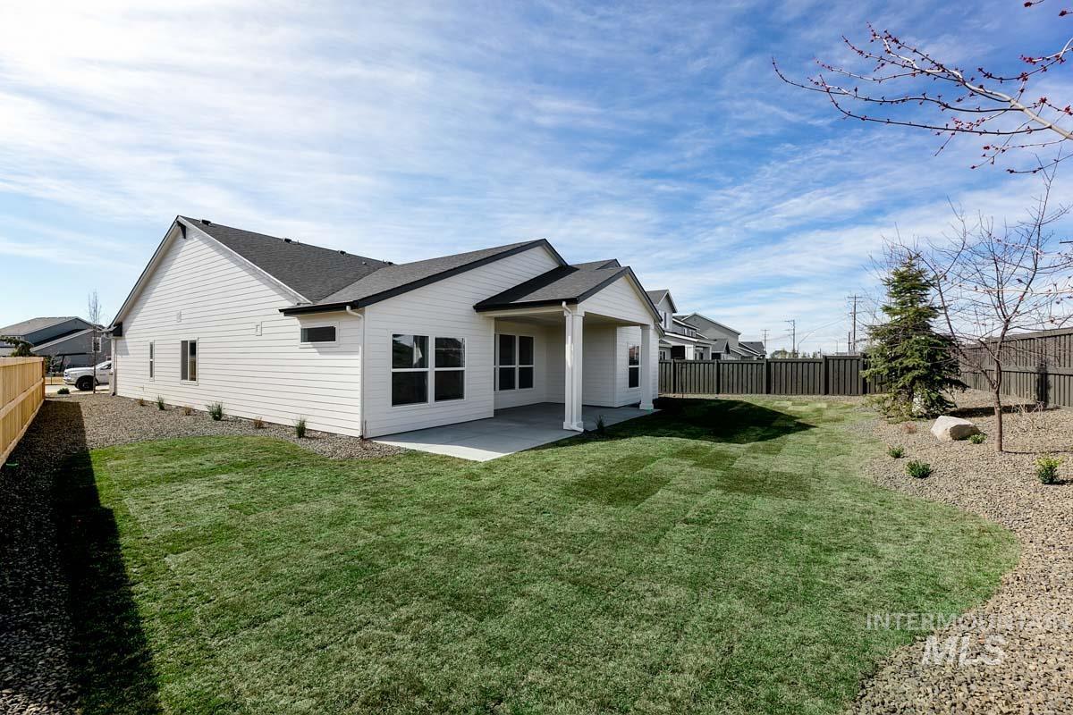 992 East Crescendo Street Meridian, ID 83642 - Photo 32 of 38 Back of house featuring a patio, a fenced backyard, and roof with shingles