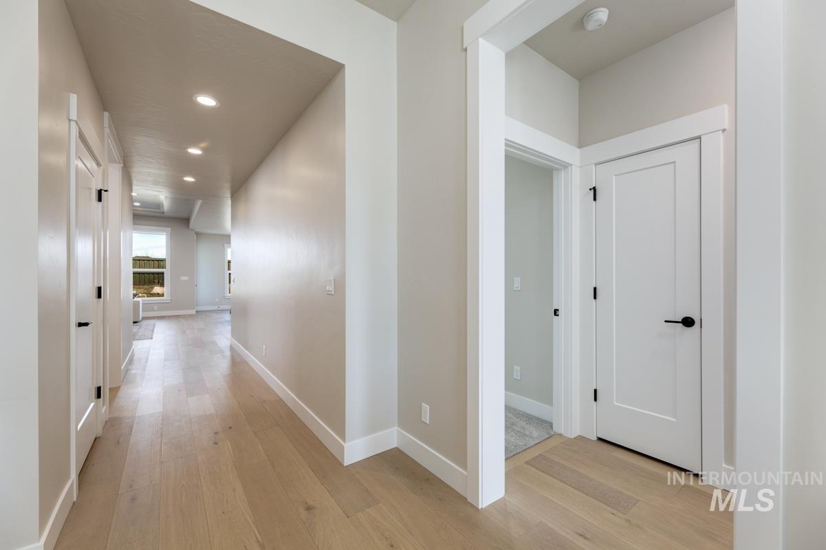 992 East Crescendo Street Meridian, ID 83642 - Photo 5 of 38 Corridor with recessed lighting and light wood-style flooring