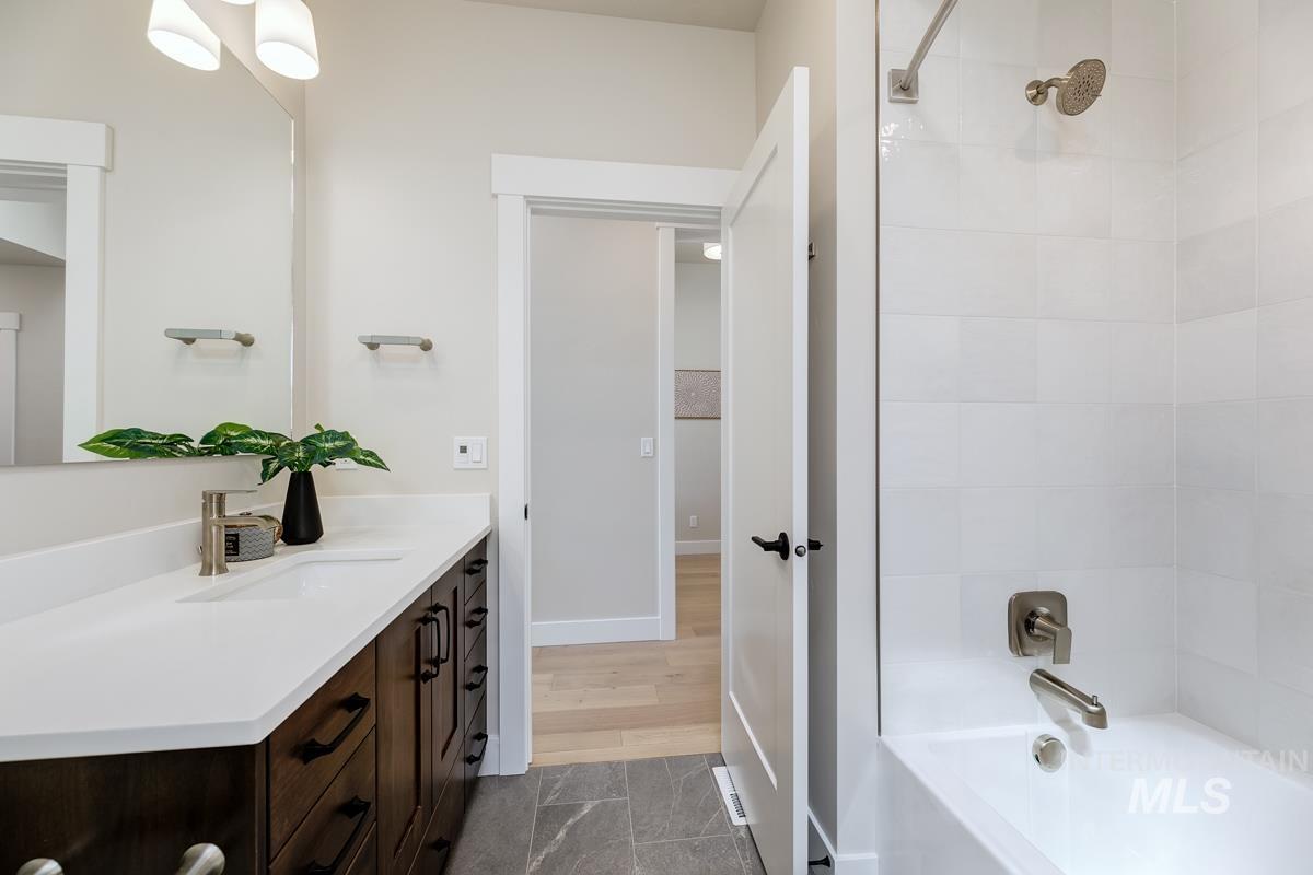 992 East Crescendo Street Meridian, ID 83642 - Photo 9 of 38 Bathroom featuring vanity and tub / shower combination