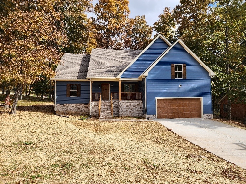 150 Hickory Ridge Lane Hartsville, TN 37074 - Photo 1 of 20 a front view of a house with a yard
