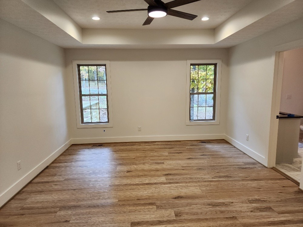 150 Hickory Ridge Lane Hartsville, TN 37074 - Photo 13 of 20 wooden floor in an empty room with a window
