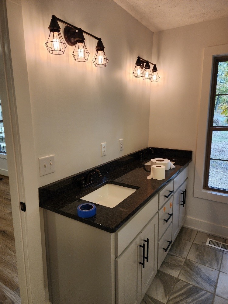 150 Hickory Ridge Lane Hartsville, TN 37074 - Photo 15 of 20 a kitchen with a sink and a stove