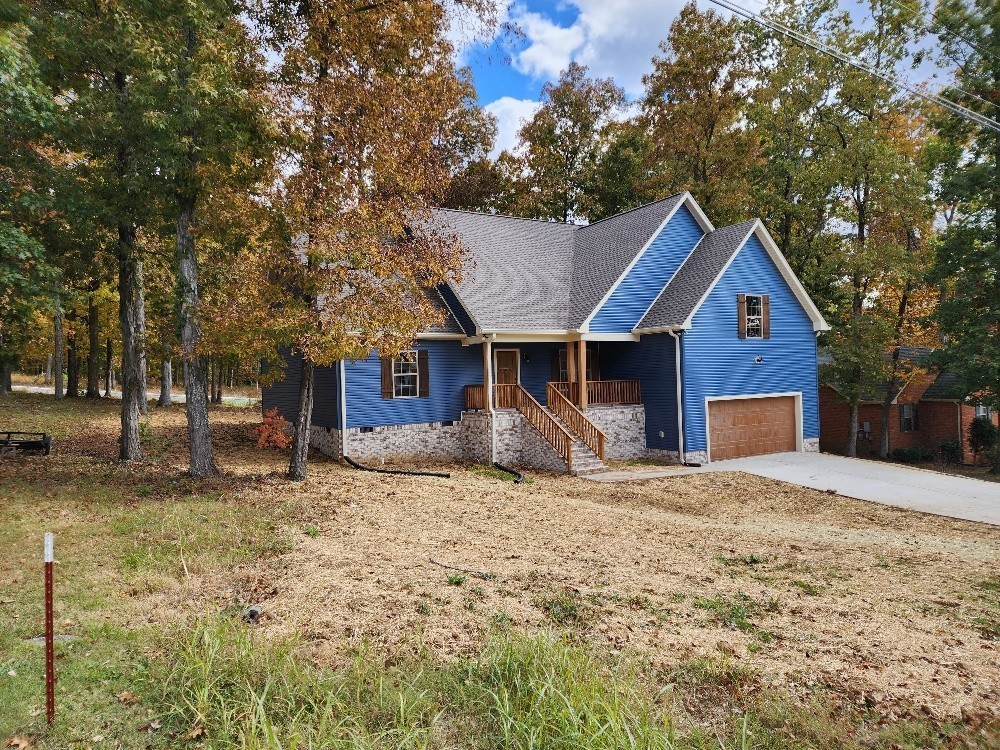 150 Hickory Ridge Lane Hartsville, TN 37074 - Photo 2 of 20 a front view of a house with a yard