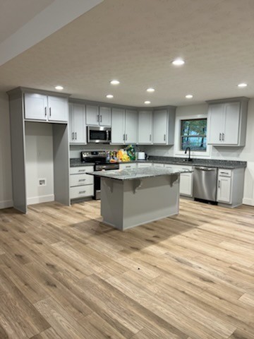 150 Hickory Ridge Lane Hartsville, TN 37074 - Photo 5 of 20 a kitchen with stainless steel appliances granite countertop a stove top oven a sink dishwasher and a refrigerator