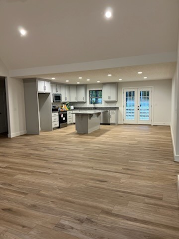 150 Hickory Ridge Lane Hartsville, TN 37074 - Photo 6 of 20 a view of a kitchen with kitchen island a sink wooden floor and a view of living room