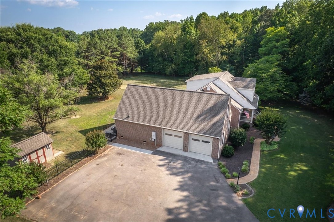 1437 Palmore Road Powhatan, VA 23139 - Photo 58 of 60 Brick home featuring a two-car garage, paved drive