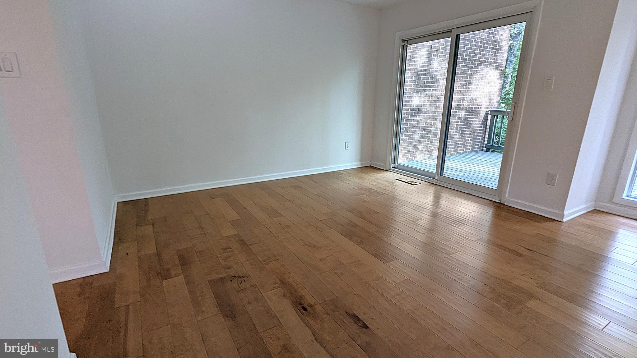 2200 Glencourse Lane Reston, VA 20191 - Photo 17 of 66 an empty room with wooden floor and windows