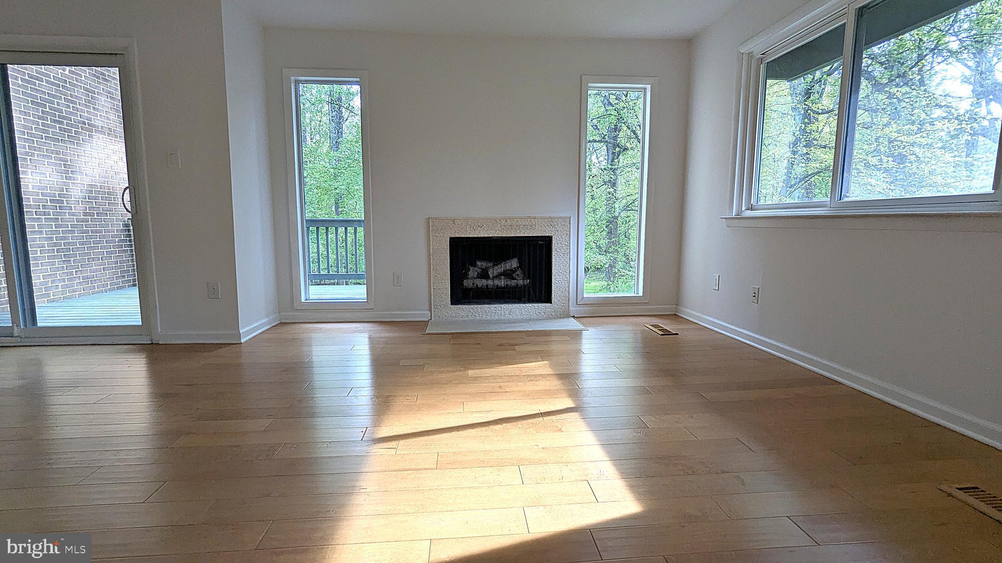 2200 Glencourse Lane Reston, VA 20191 - Photo 24 of 66 a view of a livingroom with a fireplace and window