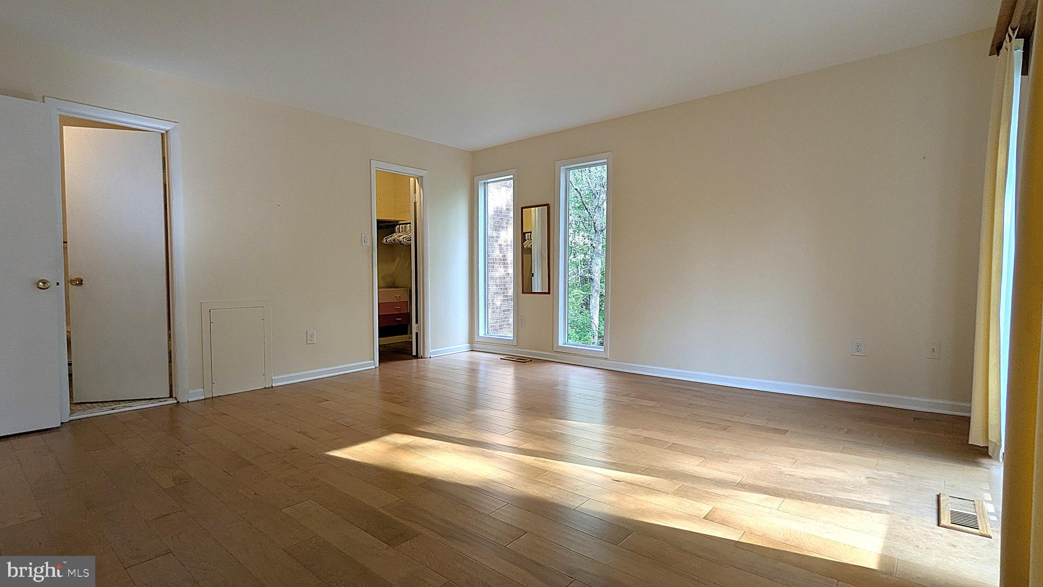 2200 Glencourse Lane Reston, VA 20191 - Photo 31 of 66 a view of an empty room with window and wooden floor