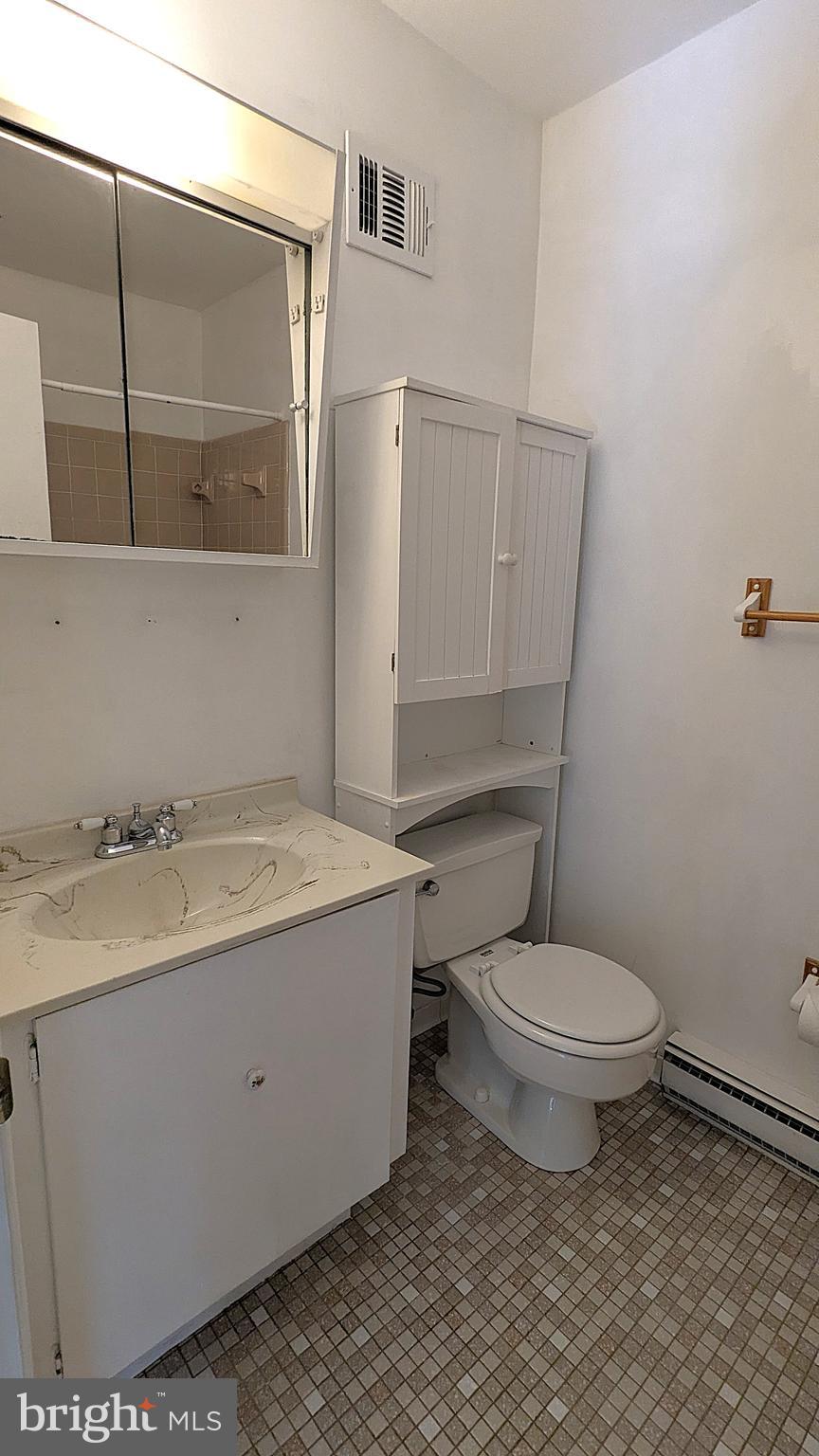 2200 Glencourse Lane Reston, VA 20191 - Photo 32 of 66 a bathroom with a granite countertop toilet and a sink