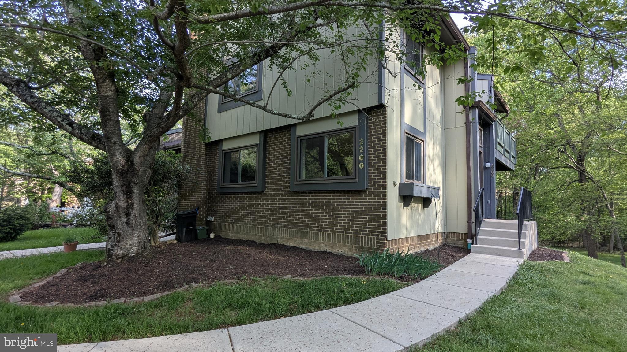 2200 Glencourse Lane Reston, VA 20191 - Photo 4 of 66 a view of a house with a garden