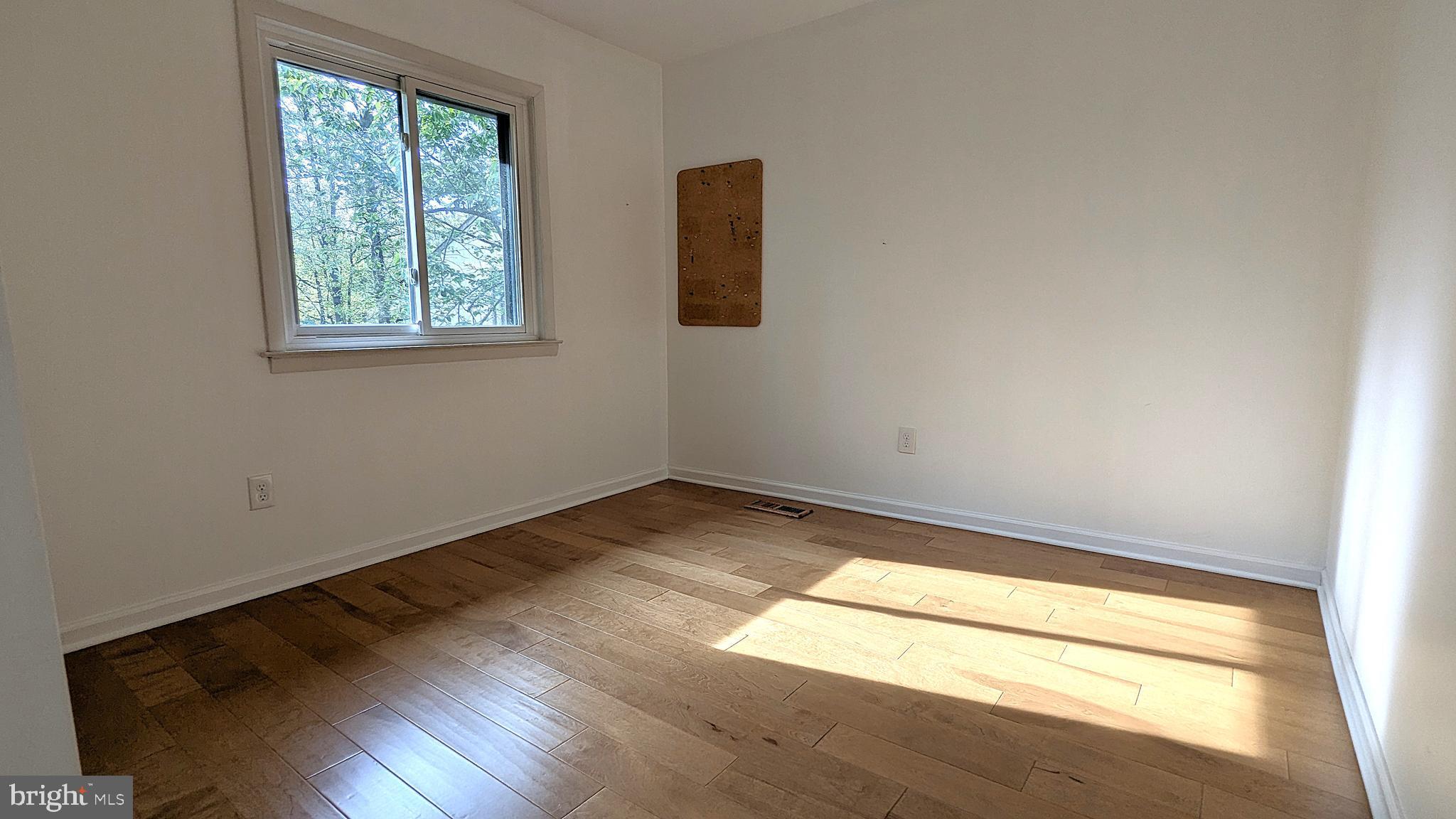 2200 Glencourse Lane Reston, VA 20191 - Photo 41 of 66 an empty room with wooden floor and windows