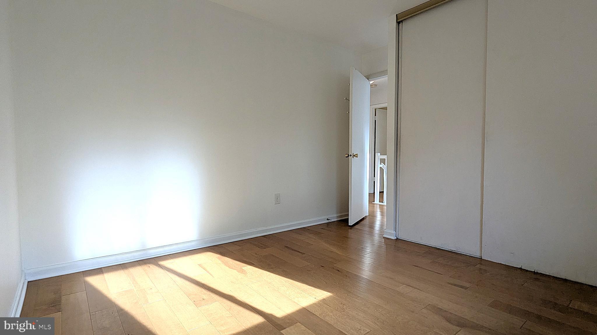 2200 Glencourse Lane Reston, VA 20191 - Photo 43 of 66 an empty room with wooden floor and windows