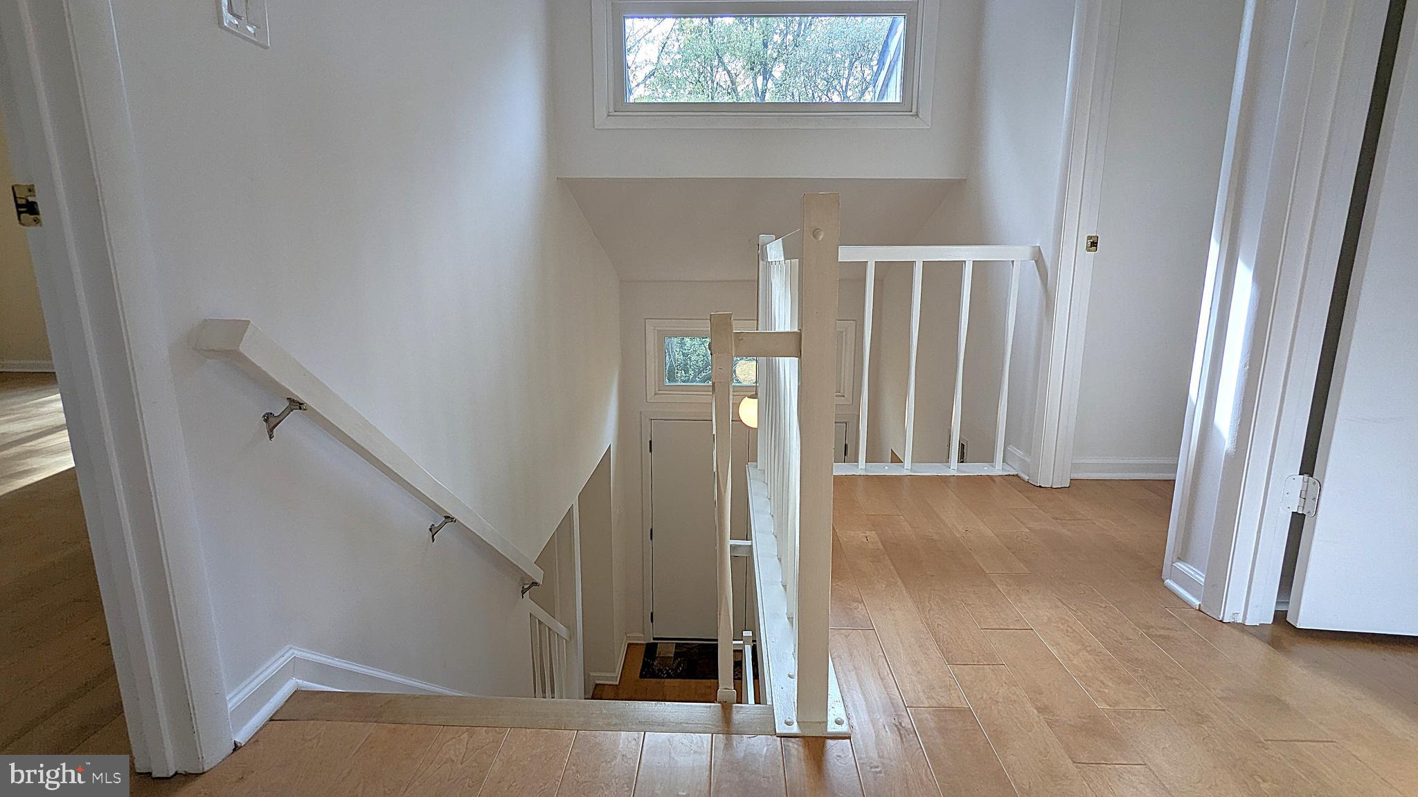 2200 Glencourse Lane Reston, VA 20191 - Photo 44 of 66 a view of entryway and hall with wooden floor
