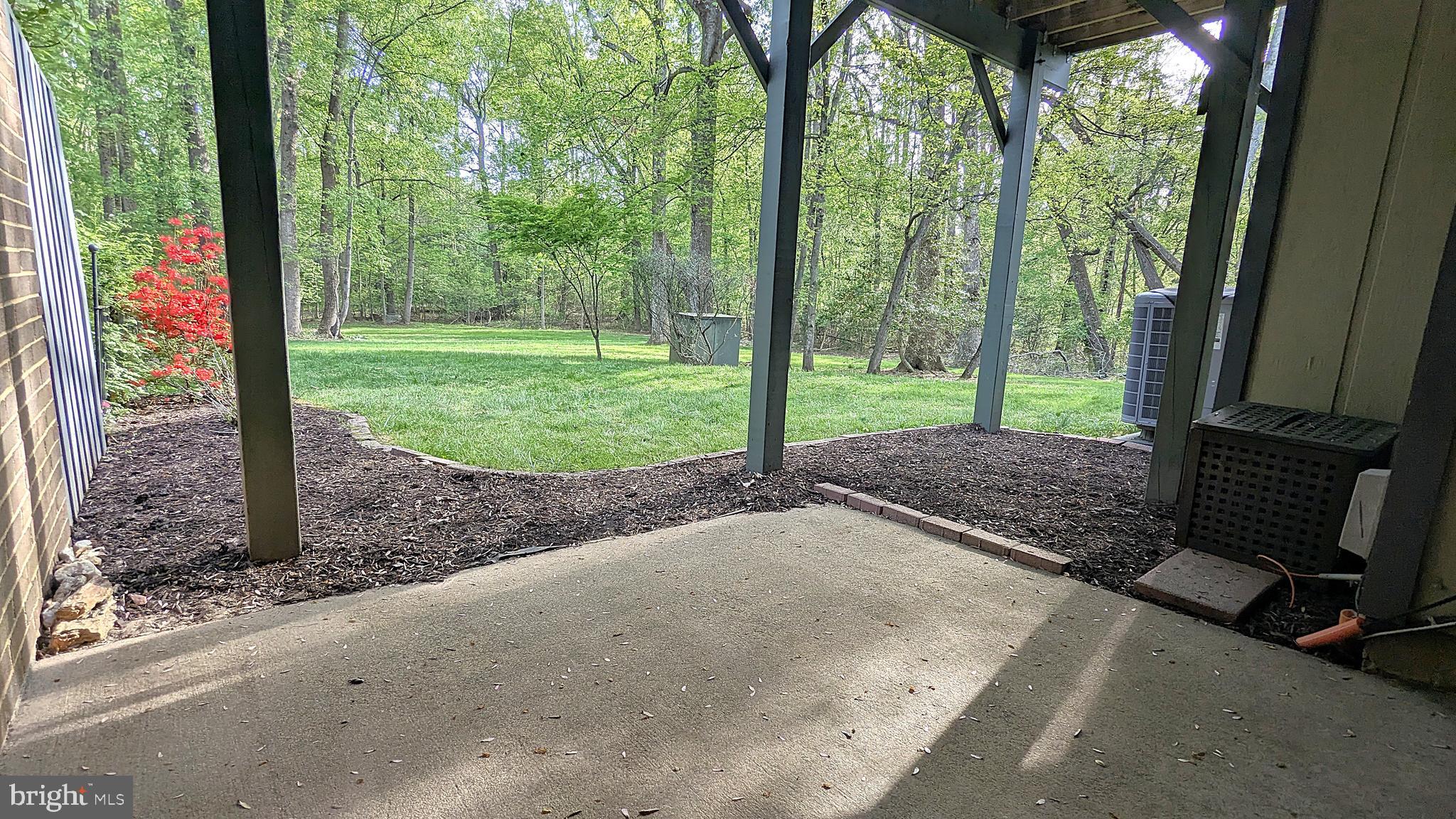 2200 Glencourse Lane Reston, VA 20191 - Photo 58 of 66 a view of a yard with porch and wooden fence