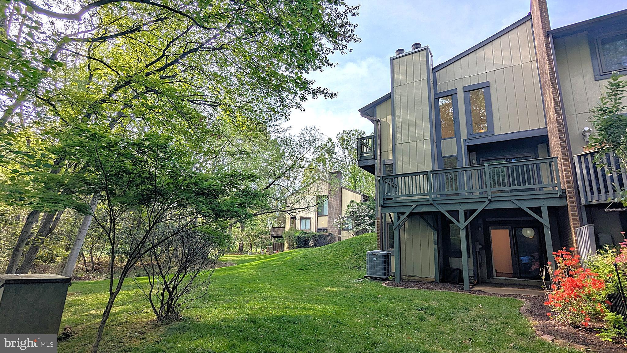 2200 Glencourse Lane Reston, VA 20191 - Photo 60 of 66 front view of house with a garden