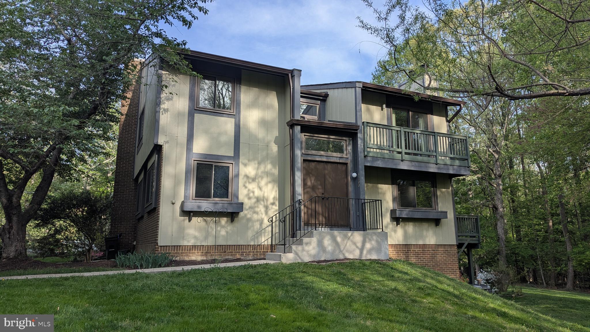 2200 Glencourse Lane Reston, VA 20191 - Photo 63 of 66 a front view of a house with a yard