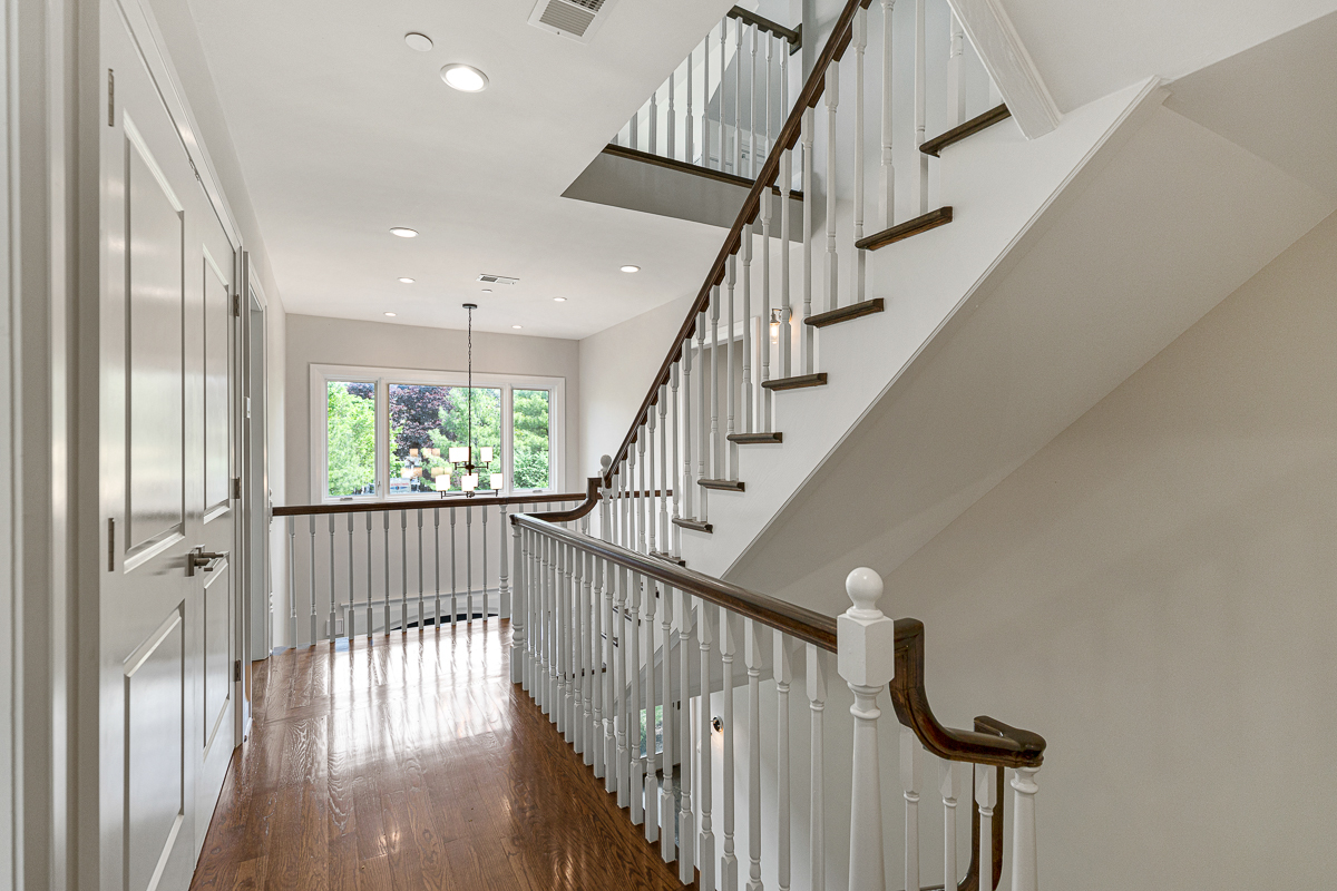 234 Sheridan Road Kenilworth, IL 60043 - Photo 22 of 41 a view of staircase with wooden floor and white walls