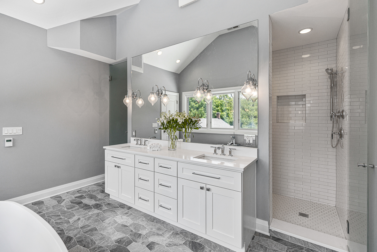 234 Sheridan Road Kenilworth, IL 60043 - Photo 26 of 41 a spacious bathroom with a double vanity sink and a mirror