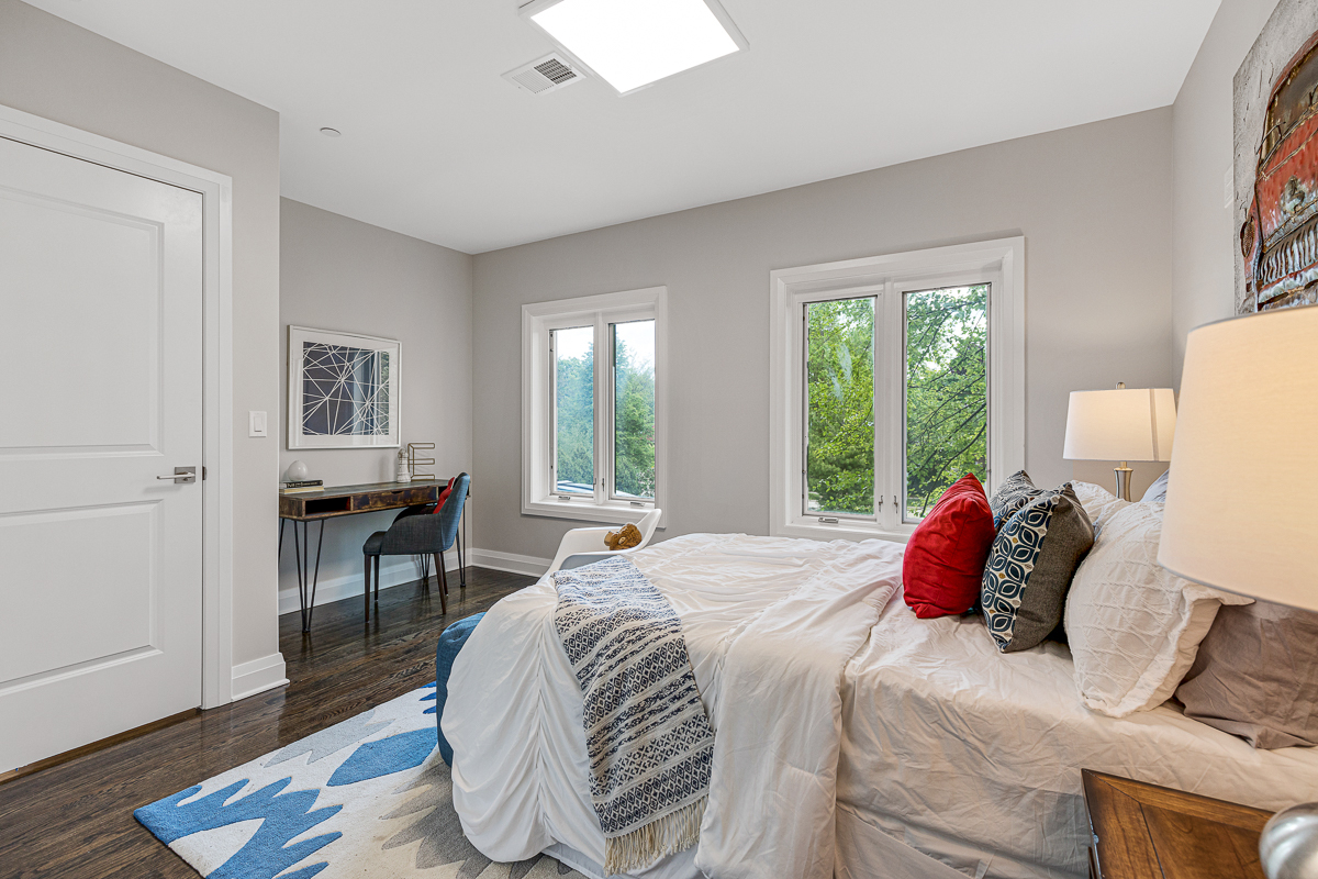234 Sheridan Road Kenilworth, IL 60043 - Photo 28 of 41 a bedroom with a bed and wooden floor