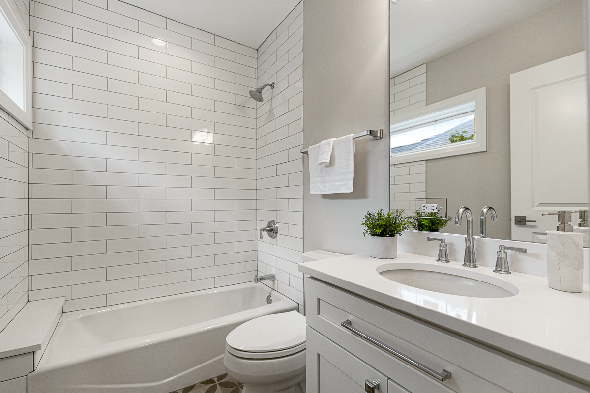 234 Sheridan Road Kenilworth, IL 60043 - Photo 29 of 41 a bathroom with a granite countertop bathtub shower sink vanity mirror and toilet