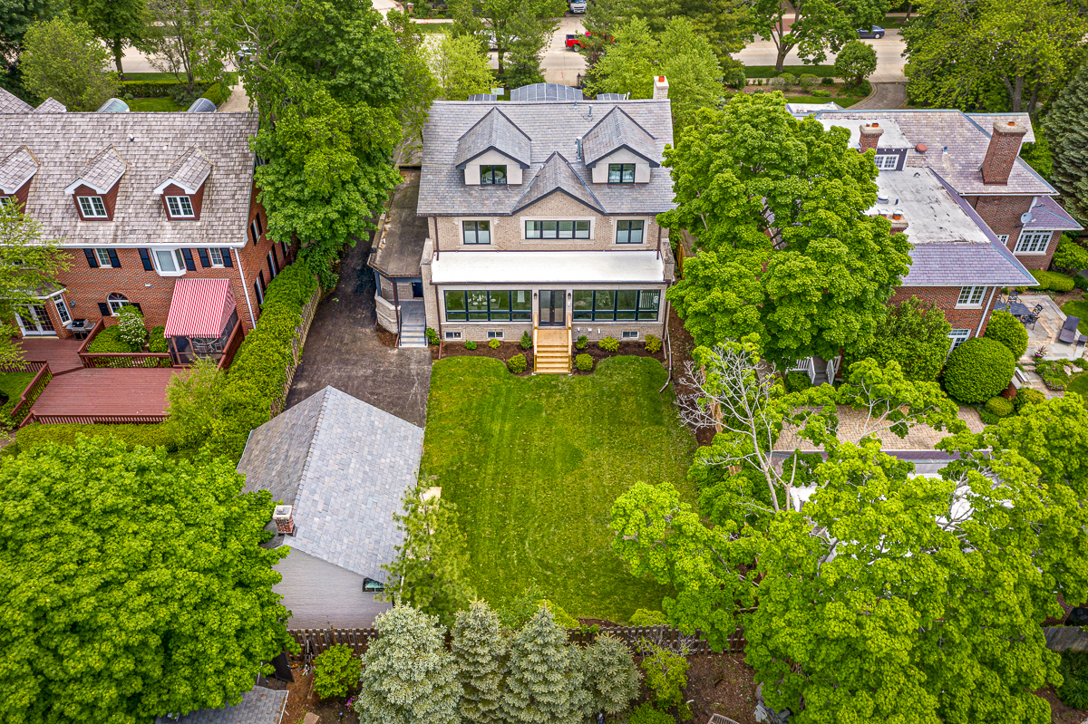 234 Sheridan Road Kenilworth, IL 60043 - Photo 4 of 41 an aerial view of a house with a garden and trees
