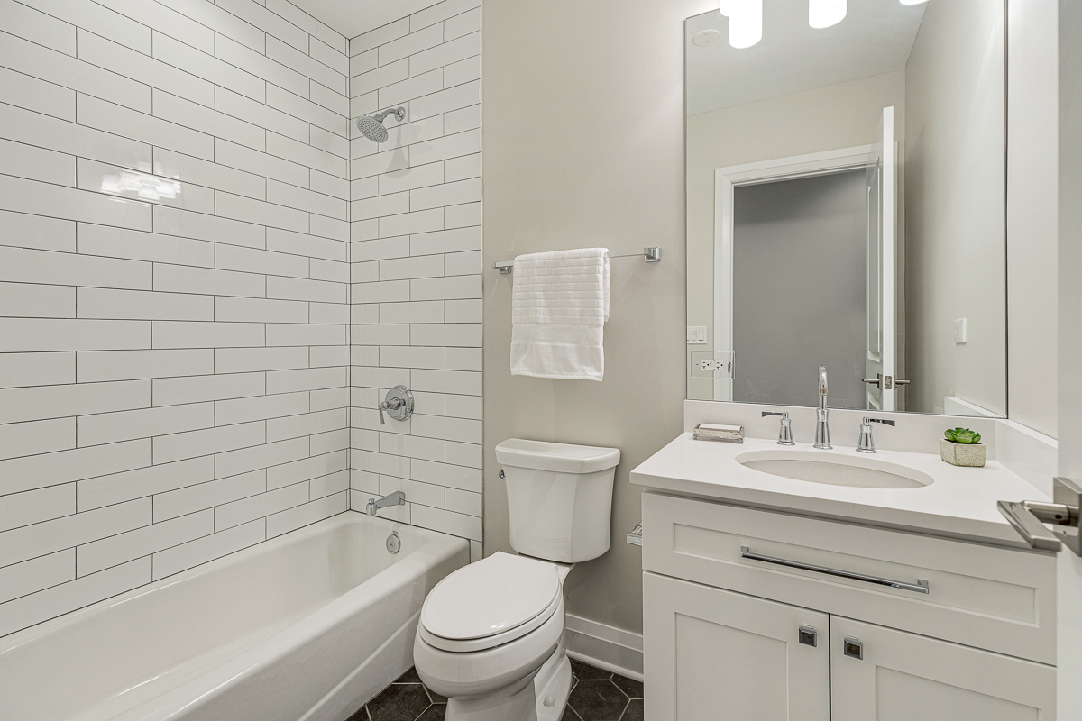 234 Sheridan Road Kenilworth, IL 60043 - Photo 31 of 41 a bathroom with a sink a toilet and shower