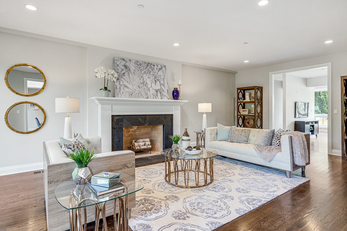 234 Sheridan Road Kenilworth, IL 60043 - Photo 9 of 41 a living room with furniture a fireplace and a table