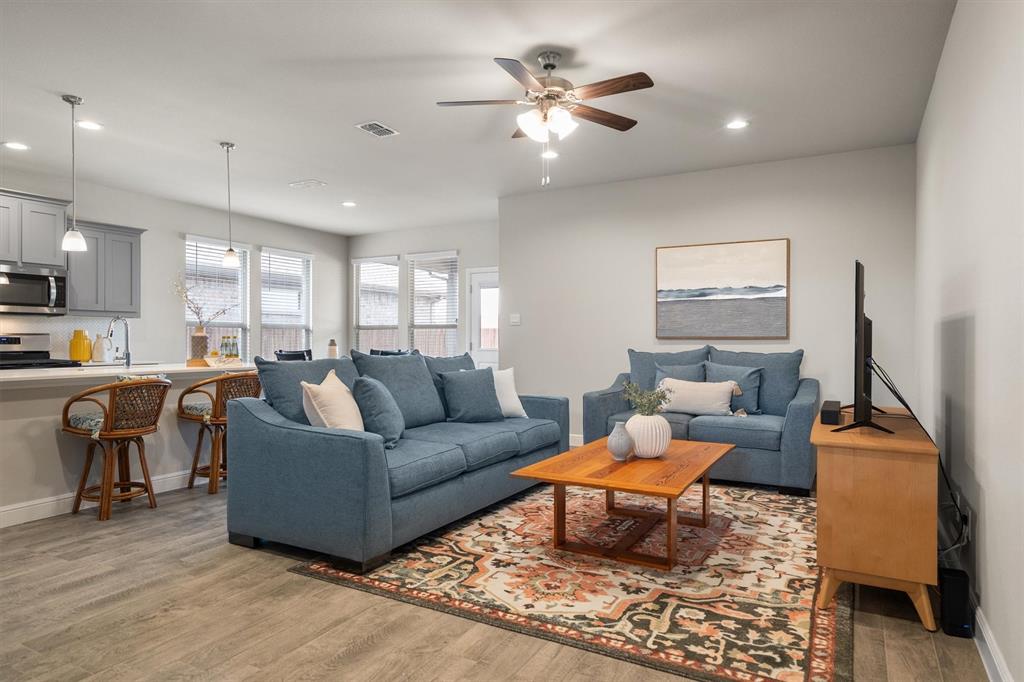 1864 Mensa Drive Haslet, TX 76052 - Photo 9 of 40 a living room with furniture and kitchen view