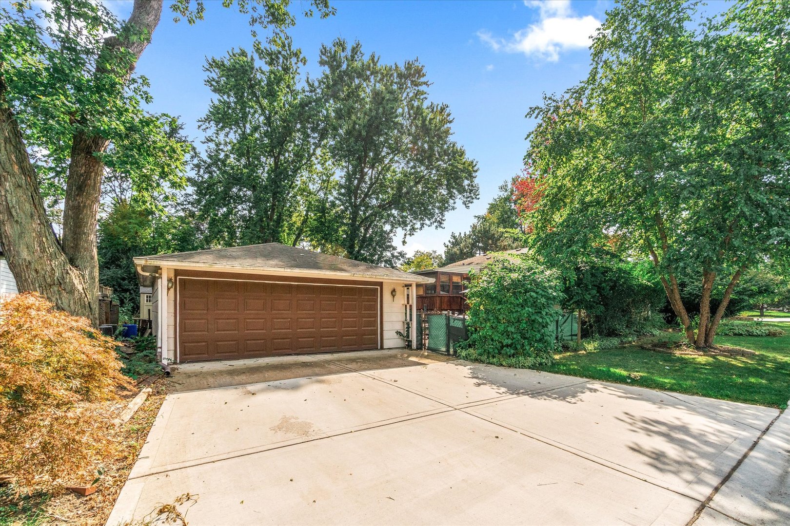 719 North President Street Wheaton, IL 60187 - Photo 2 of 16 a front view of a house with a yard and garage