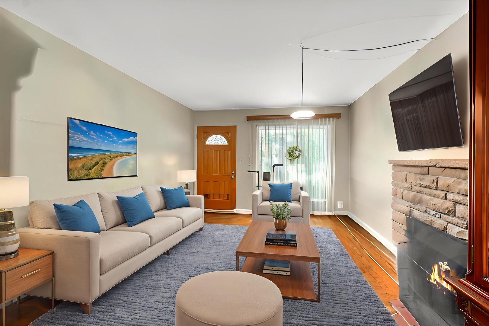 719 North President Street Wheaton, IL 60187 - Photo 3 of 16 a living room with furniture a fireplace and a flat screen tv