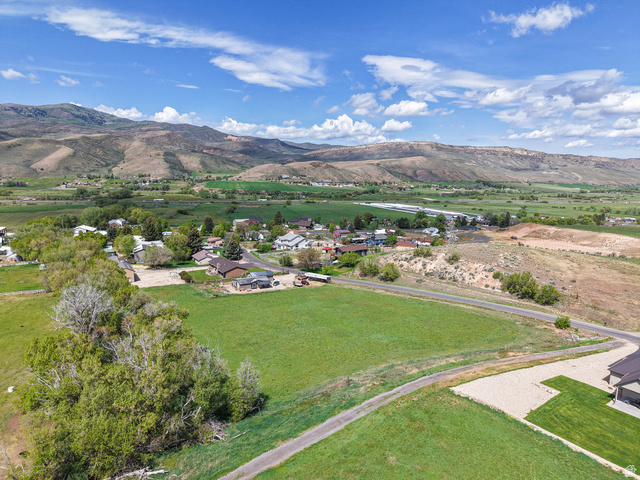 94 Spring Canyon Road Coalville, UT 84017 - Photo 17 of 50 Expansive green acreage with mature perimeter trees, offering open space and direct road access