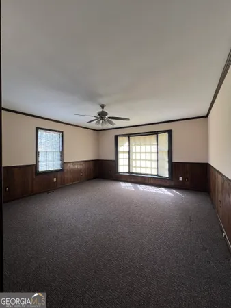 a view of empty room with windows