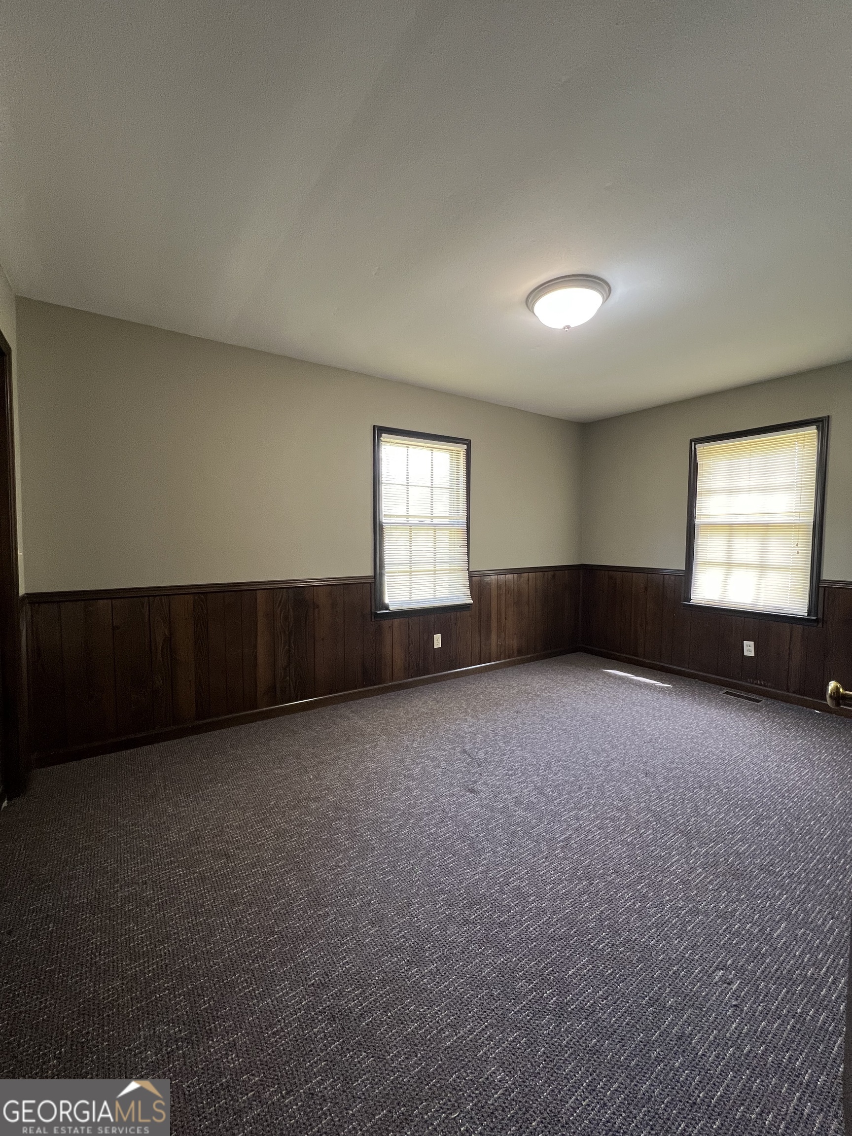 115 Old Stone Road Villa Rica, GA 30180 - Photo 14 of 18 an empty room with windows